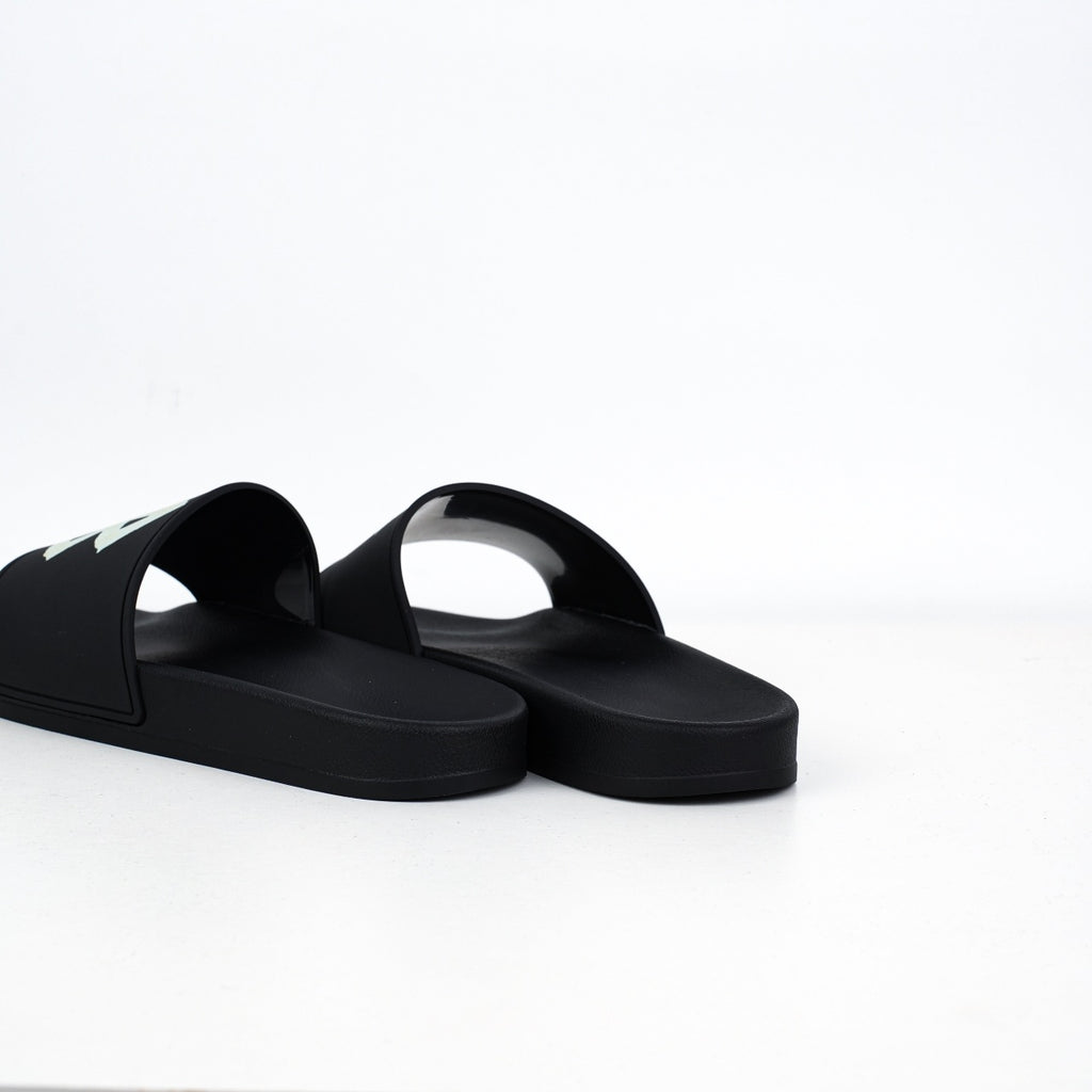 Balenciaga
Tape-logo slides